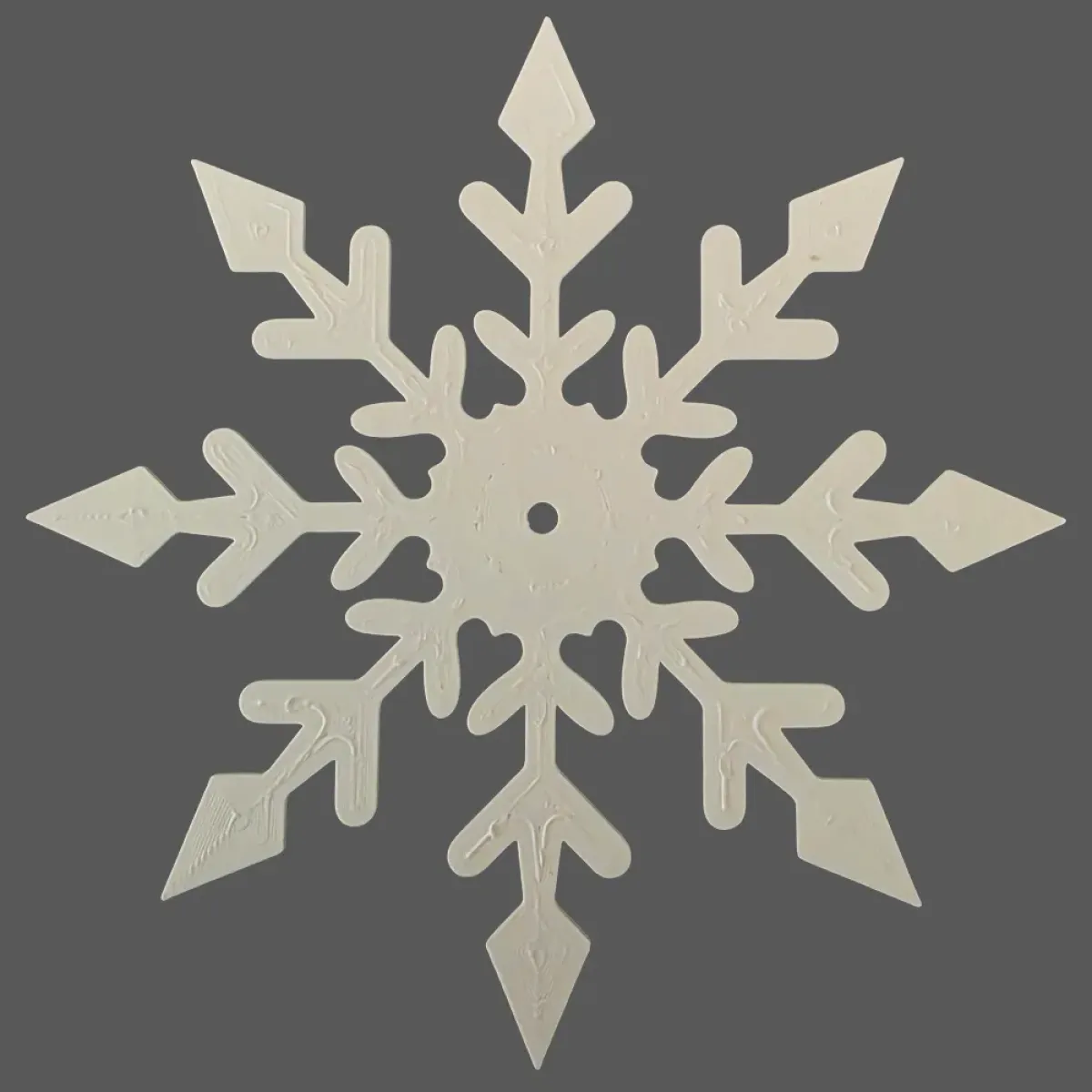 Symmetrical white-colored snowflake with six main branches and fine details, perfect for eco-conscious holiday decor or crafting